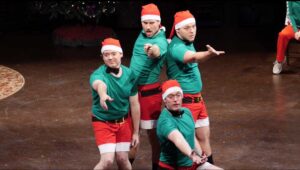 In a mad medley of holiday music, the Queen Boy Dancers, costumed in bright green T-shirts, red Santa caps, red shorts, black socks and shoes, do high-energy choreography to rival the famed Rockettes in 'Queen Family's Very Special Holiday Special'