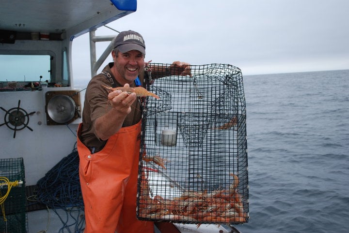 Fisherman Steve Escobar shows off his catch aboard the Ocean Pearl. (Photo courtesy Community Seafood)