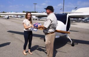 Samohi junior and scholarship winner, Claire Goldberg (left), receiving her award from Joe Justice, principal donor. (Photo courtesy Kambiz Taleghani)