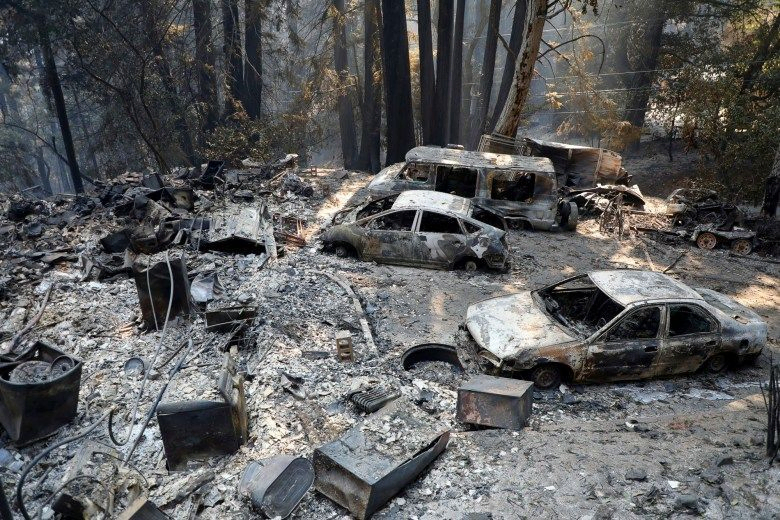 Burned cars are photographed at a home during the CZU Lightning Complex Fire on Sunday, Aug. 23, 2020, near Boulder Creek. Photo by Aric Crabb, Bay Area News Group