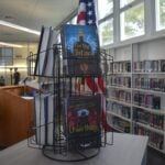 Books are seen on a shelf at a library in Santa Monica, California.